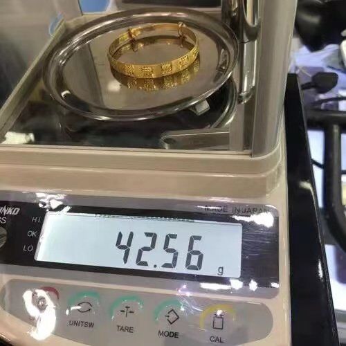 weigh the weight of gold jewelry pic